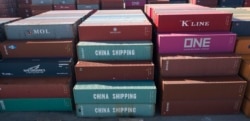FILE - China Shipping Company containers are stacked at the Virginia International terminal in Portsmouth, Virginia, May 10, 2019.