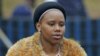 One of Swazi King Mswati's 13 wives arrives for the annual Reed Dance, at Ludzidzini in Swaziland, August 28, 2011.