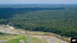 Marine One carrying President Joe Biden flies over the Amazon during a tour, Nov. 17, 2024, in Manaus, Brazil.