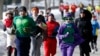 Runners in costume train for the Boston Marathon in Newton, Massachusetts, March 1, 2014.