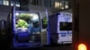 A worker cleans up inside an ambulance outside an emergency department of a hospital, amid the COVID-19 outbreak, in Chengdu, Sichuan province, China Dec. 27, 2022. 