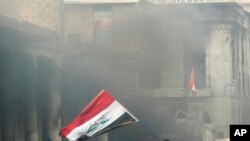 Anti-government protesters gather on Rasheed Street during clashes with security forces in Baghdad, Iraq, Nov. 29, 2019.