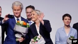 AfD (Alternative for Germany) chairwoman Frauke Petry, right, Far-right leader and candidate for next spring presidential elections Marine le Pen from France, center, and Dutch populist anti-Islam lawmaker Geert Wilders, left, stand together after their speeches at a meeting of European Nationalists in Koblenz, Germany, Saturday, Jan. 21, 2017. (AP Photo/Michael Probst) 