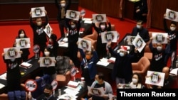 The main opposition Kuomintang (KMT) party stages a protest to oppose the import of U.S. pork containing ractopamine in Taipei, Dec 23, 2020.