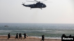 FILE - Pakistan Navy soldiers conduct a counterterrorism exercise naval exercise in Karachi, March 5, 2013. Pakistan has become increasingly reliant on China as a weapons supplier in recent years. 