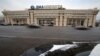 FILE - Cars pass by the former Russian RIA Novosti information agency headquarters in Moscow, Dec. 9, 2013. Major brands in the export division of Russian media include RT, the RIA Novosti news agency, Sputnik and the Voice of Russia radio station.