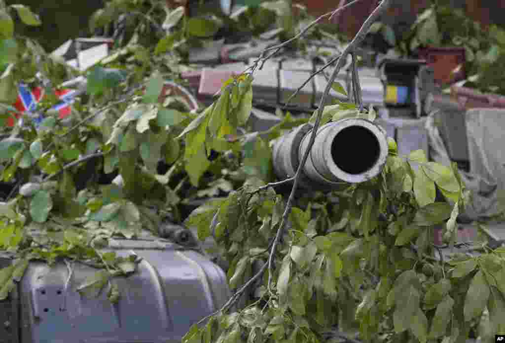 A camouflaged pro-Russian tank is seen in the town of Novoazovsk, in eastern Ukraine, Aug. 29, 2014. 