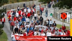 Supporters of Michael Kovrig and Michael Spavor march in Ottawa, Sep 5, 2021.