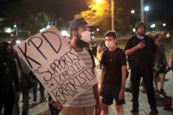 Demonstrators protests the shooting of Jacob Blake on Aug. 26, 2020, in Kenosha, Wis.