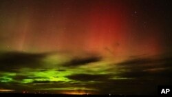 An aurora borealis, also known as the northern lights, is seen in the night sky in the early morning hours of April 24, 2023, near Washtucna, Washington. 