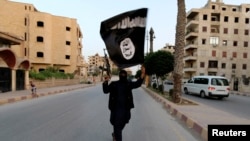 Militant du groupe Etat Islamique à Raqqa le 29 juin 2014. (Photo d'illustration - Reuters)