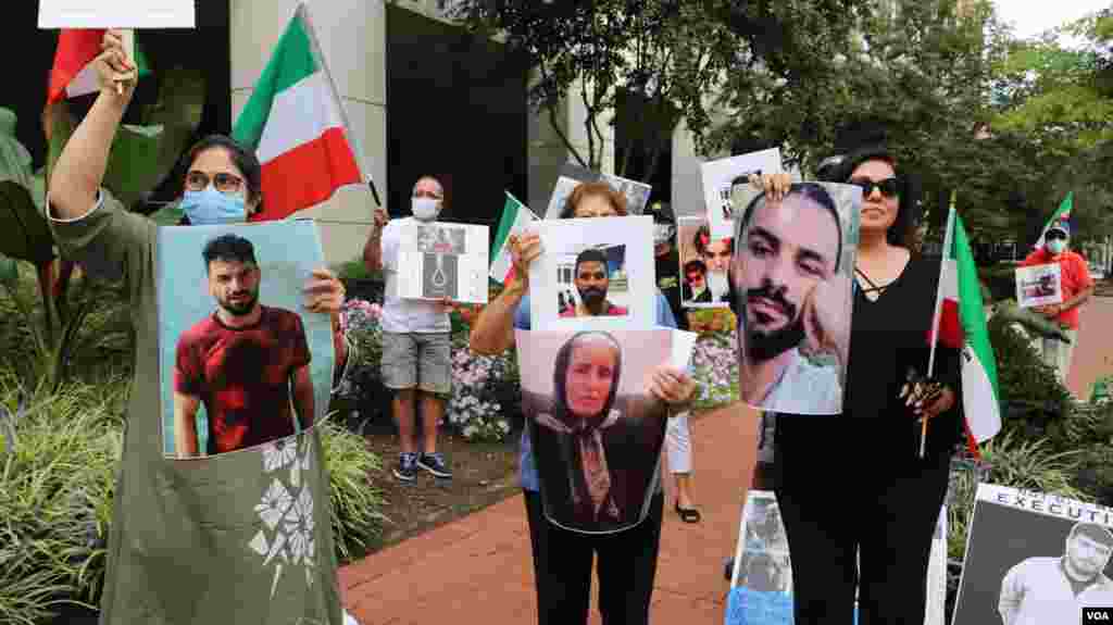 تجمع اعتراض به اعدام نوید افکاری مقابل دفتر حفاظت از منافع جمهوری اسلامی در واشنگتن - جمهوری اسلامی ایران به رغم درخواستهای گسترده جهانی، این ورزشکار کشتیگیر را روز شنبه ۲۲ شهریور اعدام کرد.