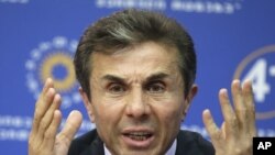 Georgia's billionaire and opposition leader Bidzina Ivanishvili speak to the media during press conference in Tbilisi, Georgia, Tuesday, Oct. 2, 2012. 