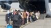 FILE - Evacuees assemble before boarding a C-17 Globemaster III during an evacuation at Hamid Karzai International Airport, Aug. 18, 2021. (U.S. Marine Corps/Lance Cpl. Nicholas Guevara/Handout via Reuters)