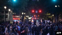 People protest in front of the Multnomah County Justice Center in Portland, Oregon, on July 17, 2020.