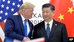 Дональд Трамп и Си Цзиньпинь во время встречи на полях саммита G-20 в Осаке, 29 июня 2019 года (архивное фото AP/Susan Walsh). 