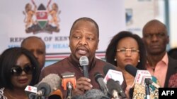FILE - Kenya's Health Minister Mutahi Kagwe (C) speaks at Mbagathi Hospital during the launch of an isolation and treatment center for coronavirus patients, in Nairobi, Kenya, March 6, 2020.