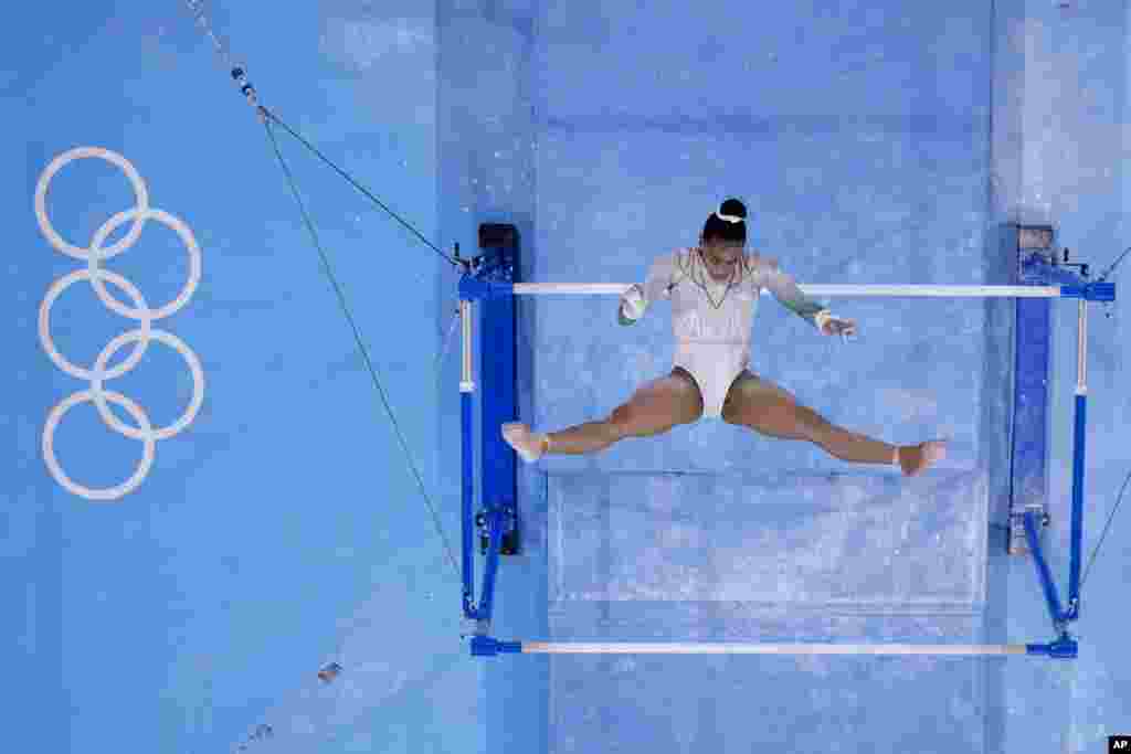 Caitlin Rooskrantz, of South Africa, performs on the uneven bars during women's artistic gymnastic qualifications at the 2020 Summer Olympics, Sunday, July 25, 2021, in Tokyo. (AP Photo/Morry Gash)