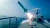 Kapal Garda Revolusi Iran menembakkan rudal saat latihan militer di Selat Hormuz, dalam foto yang dirilis Selasa, 28 Juli 2020. (Sepahnews via AP)