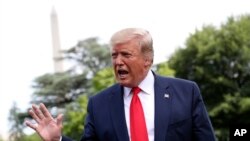 President Donald Trump speaks with the media before boarding Marine One on the South Lawn of the White House.