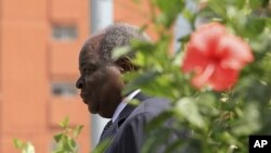 Kenya's President Mwai Kibaki arrives at the parliament building in the capital Nairob,i March 22, 2011