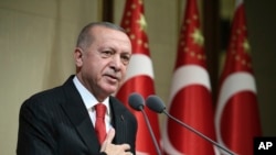 Turkish President Recep Tayyip Erdogan speaks during a reception on Republic Day, in Ankara, Turkey, Oct. 29, 2019. 