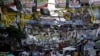 Election posters for the 2016 national elections hang above a busy road in Tondo, Manila, April 26, 2016. 