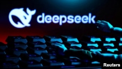 FILE - The Deepseek logo, a keyboard and robot hands are seen in this illustration made Jan. 27, 2025.