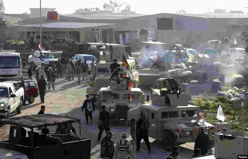 Iraqi security forces and Shi'ite Fighters clash with Islamic State militants in Saladin province, Iraq, March 2, 2015.