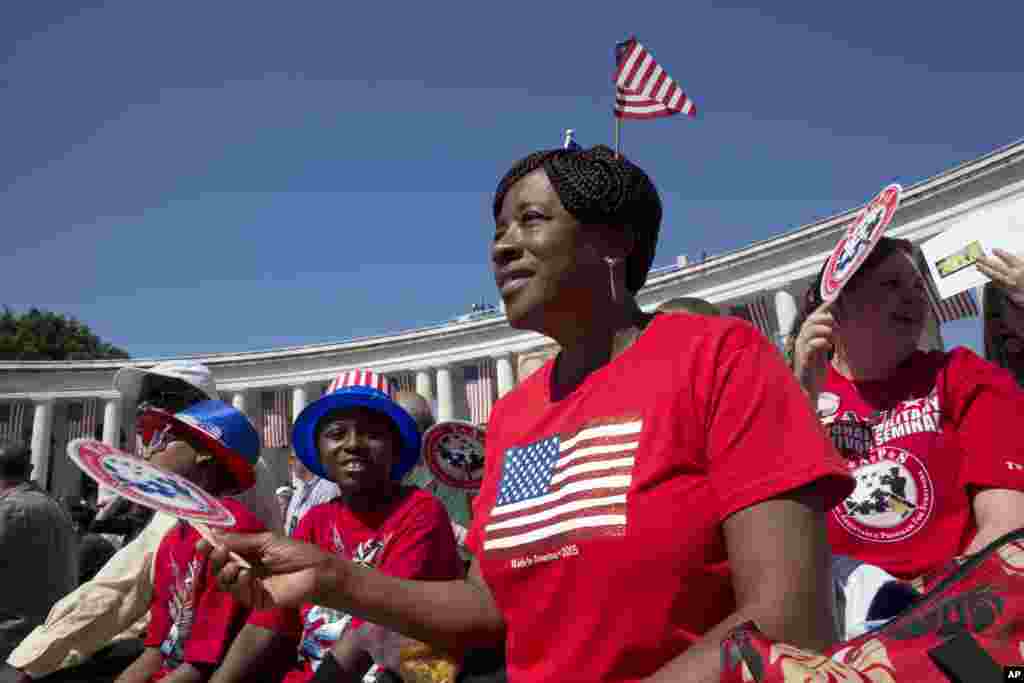 Sandra Bacchus attends a Memorial Day ceremony with others at Arlington National Cemetery, May 25, 2015.