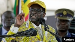 Zimbabwe's President Robert Mugabe addresses supporters at the elective congress in Harare, Zimbabwe, Dec. 4, 2014.