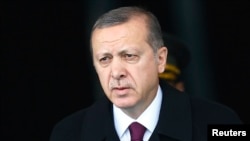 FILE - Turkey's President Tayyip Erdogan arrives for a welcoming ceremony at the Presidential Palace in Ankara, March 3, 2015. 