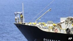 Suspected pirates indicate their surrender with a white cloth on the bow of the Japanese-owned commercial oil tanker MV Guanabara in the Arabian Sea (File Photo -March 6, 2011)