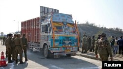 Indian security forces stand around a truck which was used by suspected militants, at the site of a gun battle at Nagrota, on the outskirts of Jammu, January 31, 2020.