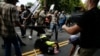 Experts: Saturday's Violence the Result of Political Pressure Cooker