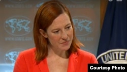 FILE - Then-State Department spokesman Jen Psaki is seen in a State Department video. Excerpts from an earlier briefing video were deliberately removed, leading to a new policy for how video and transcripts are handled.