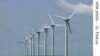 Giant wind turbines dot the landscape at the Darling Wind Power national demonstration project near Cape Town. 