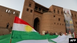 FILE - Iraqi Kurds commemorate the seventh anniversary of the Kurdistan region's independence referendum, in Erbil, Sept. 25, 2024.