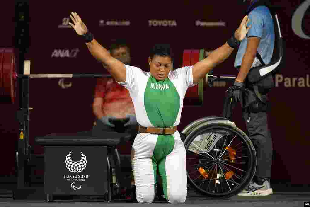 Nigeria's Folashade Oluwafemiato celebrates after winning a gold medal in women's -86kg powerlifting final at the Tokyo 2020 Paralympic Games, in Tokyo, Japan. (AP Photo/Kiichiro Sato)