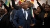 FILE - South African President Jacob Zuma, center, gathers with delegates at the opening session of the AU summit in Johannesburg, June 14, 2015. 