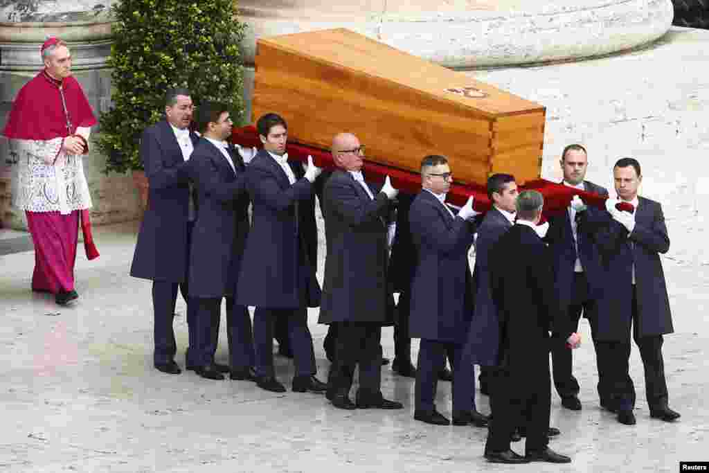 The coffin of former Pope Benedict is carried during his funeral, in St. Peter's Square at the Vatican, Jan. 5, 2023. 