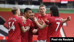 'Yan wasan Manchester United suna murnar shan kwallo, Afrilu 18, 2021.