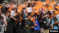 Demonstrators shout slogans in support of presidential candidate Abdullah Abdullah in Kabul, Afghanistan, June 22, 2014.