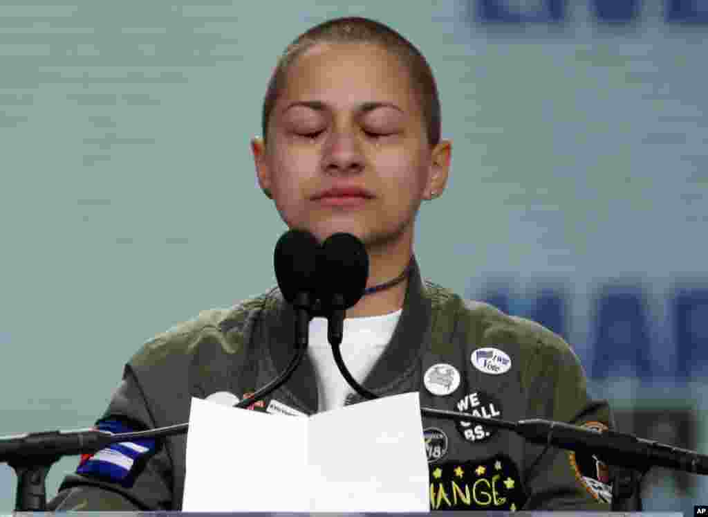 Emma Gonzalez, a survivor of the mass shooting at Marjory Stoneman Douglas High School in Parkland, Fla., closes her eyes and cries as she stands silently at the podium for the amount of time it took the Parkland shooter to go on his killing spree during the "March for Our Lives" rally in support of gun control in Washington, Saturday, March 24, 2018. (AP Photo/Alex Brandon)