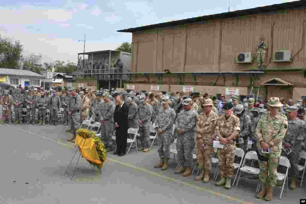 U.S. and NATO’s forces observe a moment of silence during an event to mark the Memorial Day Ceremony at the U.S Camp Eggers base in Kabul, Afghanistan on May 26, 2008. 