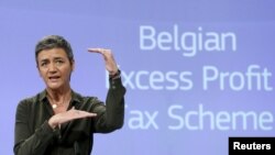 FILE - Caption European Competition Commissioner Margrethe Vestager addresses a news conference in Brussels, Belgium, Jan.11, 2016, after the EU demanded Monday that Belgium recover millions of euros from 35 large companies in back taxes.