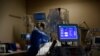 Medical staff treat a COVID-19 patient in the Intensive Care Unit at the Providence Mission Hospital in Mission Viejo, California, Jan. 25, 2022.