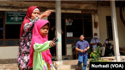 Perempuan dan anak sering kali menjadi korban dengan trauma paling berat. Kasus yang melibatkan keduanya membutuhkan keberpihakan aparat penegak hukum untuk mencapai keadilan. (Foto: VOA/Nurhadi Sucahyo)