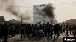 Protesters march during a rally against military rule following coup in Khartoum, Sudan, Feb. 10, 2022.