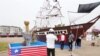 Women pose in front of a replica of the ship Elizabeth, which was called "The Mayflower of Liberia" during the Liberia bicentennial commemoration in Paynesville, a suburb of Monrovia, Liberia February 14, 2022.